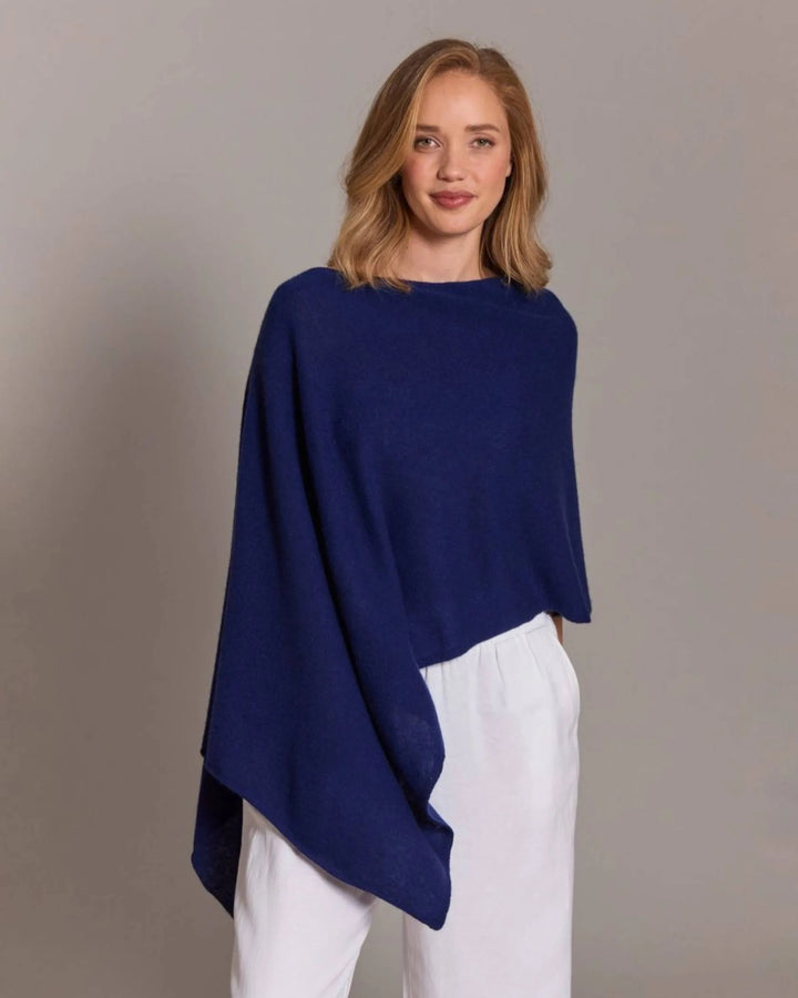 Alashan Cashmere cashmere topper top in soft, luxurious fabric with a relaxed fit and subtle color, displayed on a hanger.