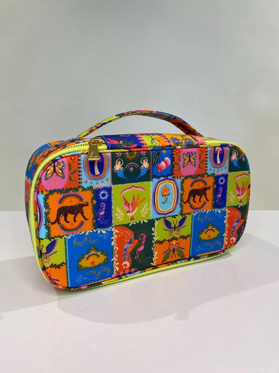 Alden Adair Nirvana makeup bag in soft fabric with a zip closure, designed as a stylish accessory for cosmetics storage.