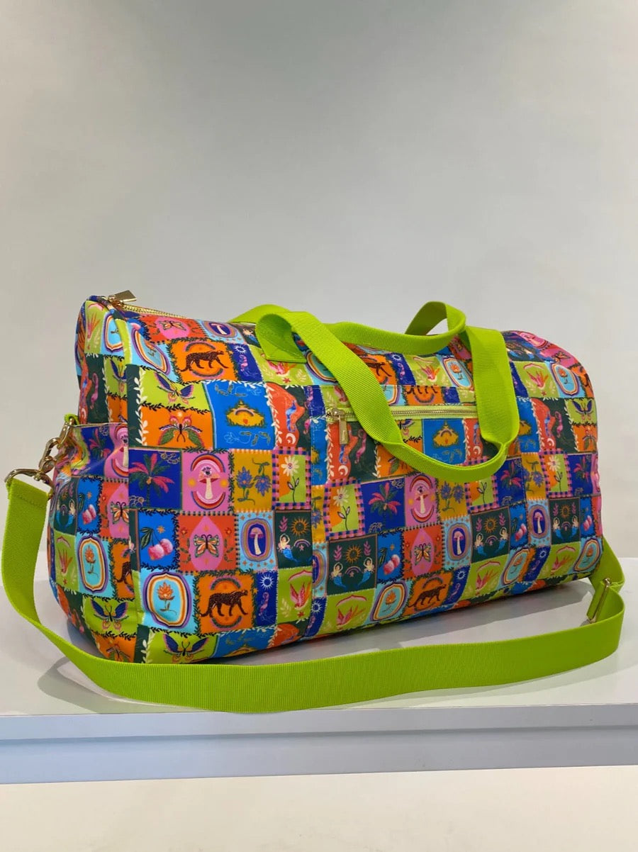 Alden Adair Nirvana Weekender Bag in durable fabric with leather accents, featuring handles and a spacious design for travel accessories.