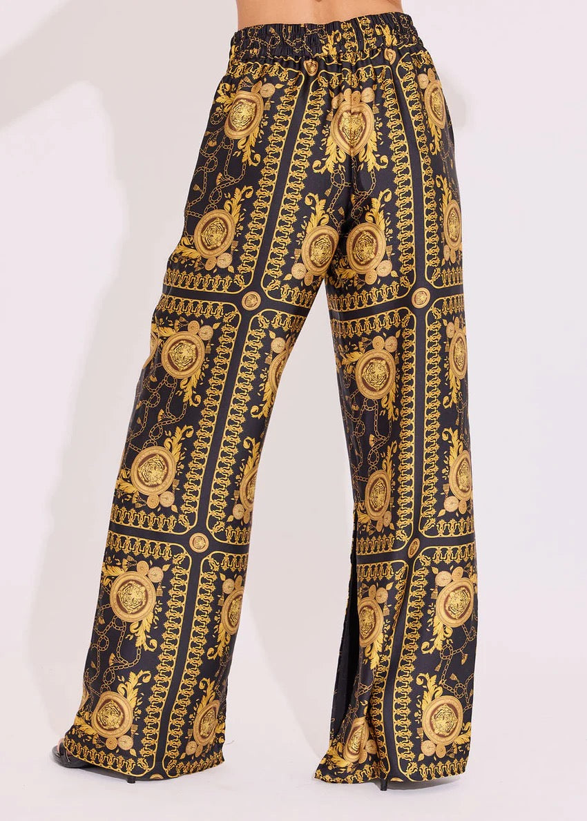 Alden Adair Donatello Penny Pant in dark denim, casual bottoms with front pockets and a tapered fit, displayed on a model.