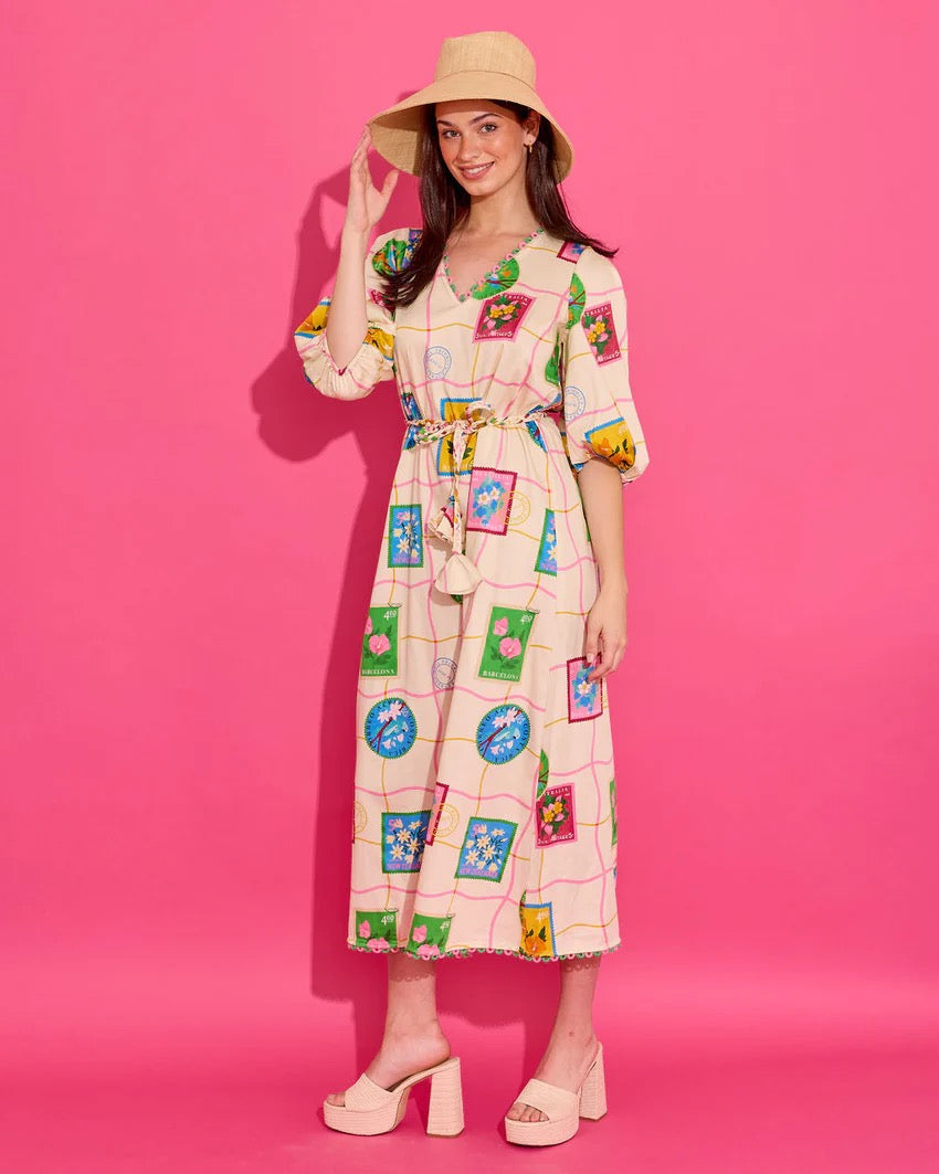 Alden Adair Lizzie Postcard Dress displayed on a hanger, featuring a colorful, patterned fabric with a relaxed fit and short sleeves.