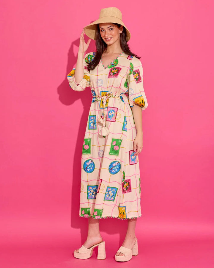 Alden Adair Lizzie Postcard Dress displayed on a hanger, featuring a colorful, patterned fabric with a relaxed fit and short sleeves.