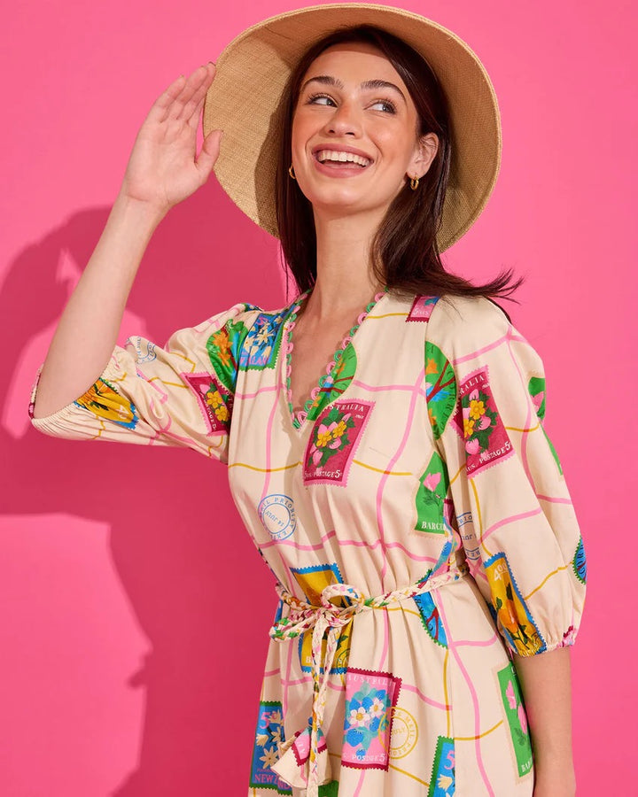 Alden Adair Lizzie Postcard Dress displayed on a hanger, featuring a colorful, vintage-inspired design with short sleeves and a flattering fit.