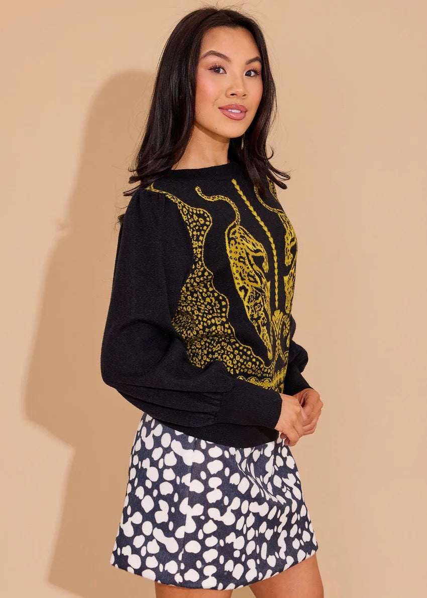Alden Adair Lucie Panther sweater, a stylish tops item featuring a detailed panther print on soft fabric, shown on a hanger.