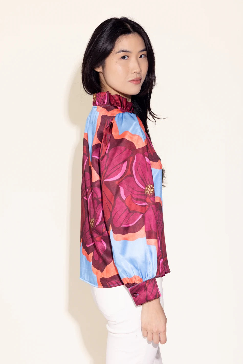 Alden Adair Phoebe Blossom blouse featuring a floral pattern, long sleeves, and a relaxed fit displayed on a hanger.