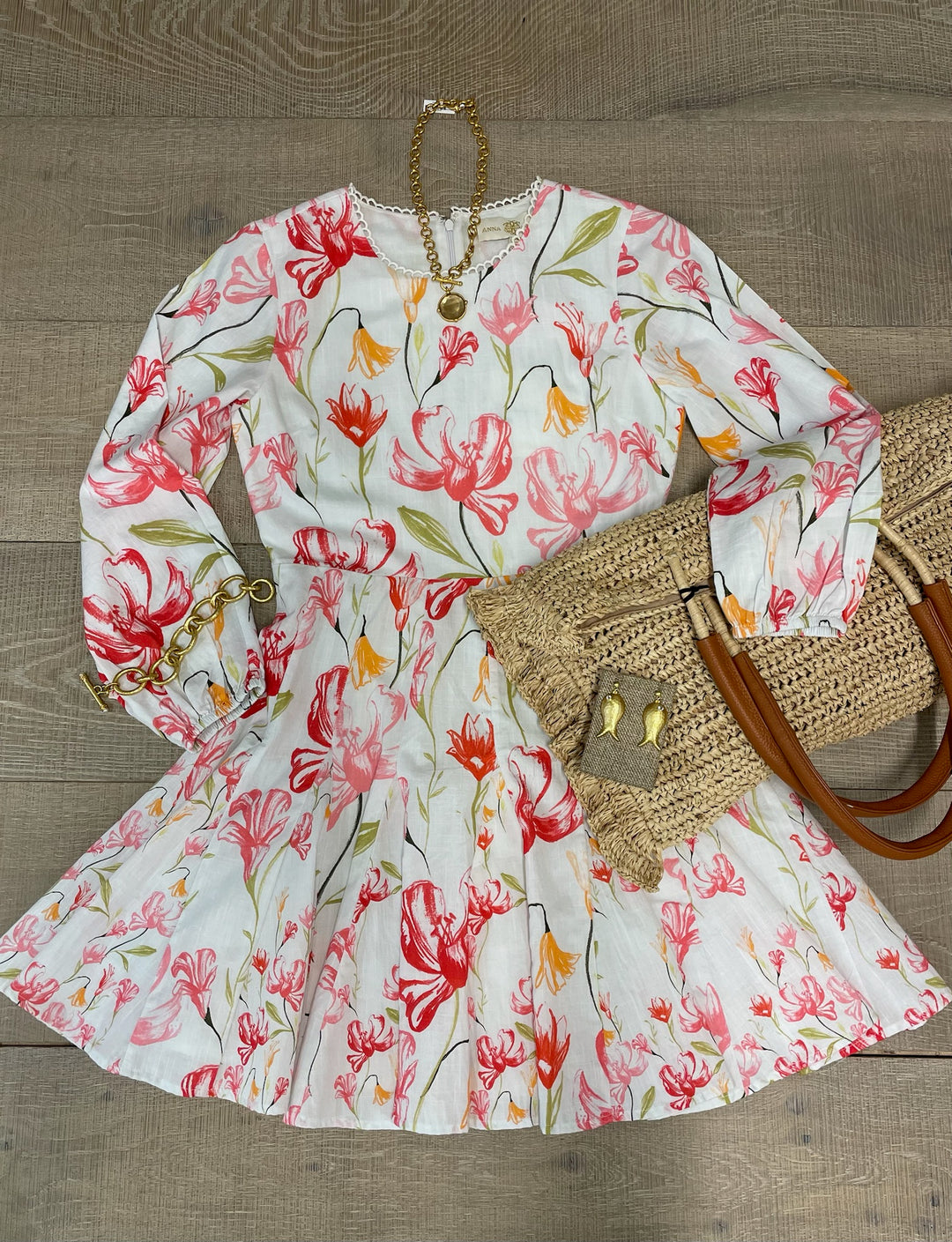 Pink Lily Dress by Anna Cate, lightweight dress with floral pattern and flowy design, perfect for spring or summer occasions.