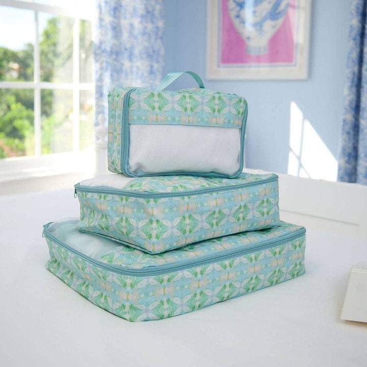 Laura Park Designs packing cubes set for travel gifts, featuring organized fabric compartments in vibrant colors.