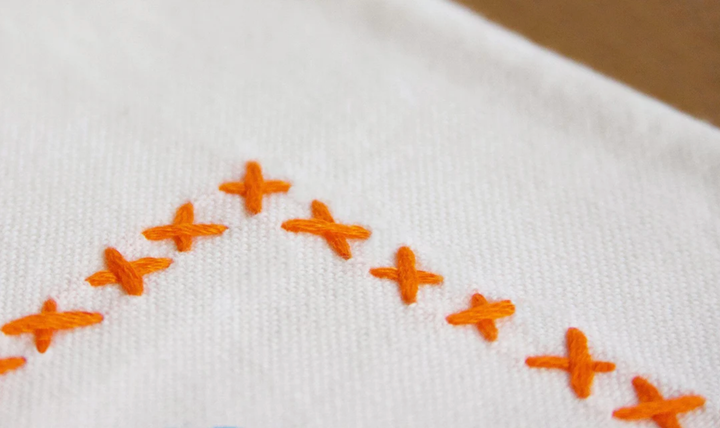 University of Virginia home towel by Catstudio featuring the school's logo and vibrant orange and navy colors.