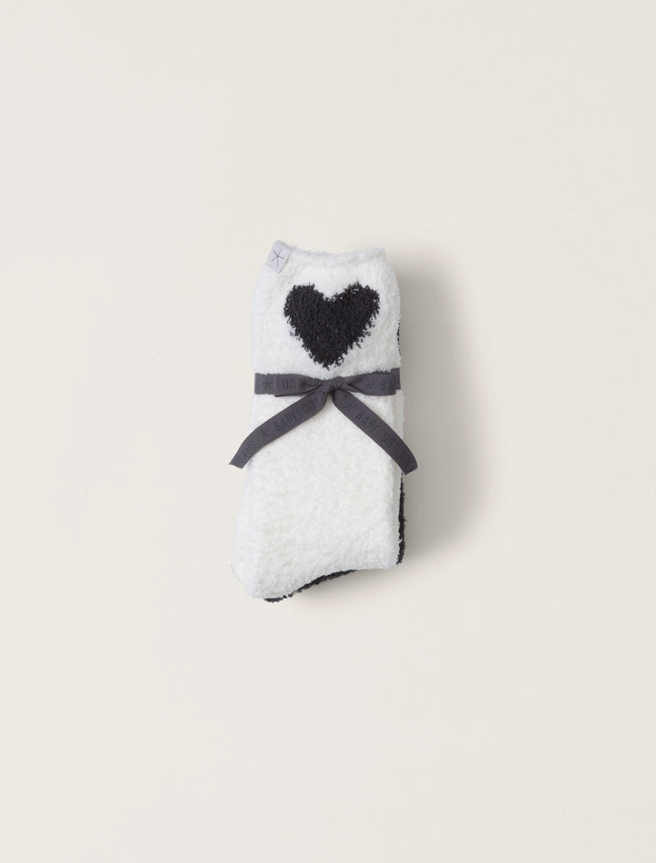 Barefoot Dreams heart print sock set featuring cozy, colorful accessories with red and pink heart designs on soft fabric.