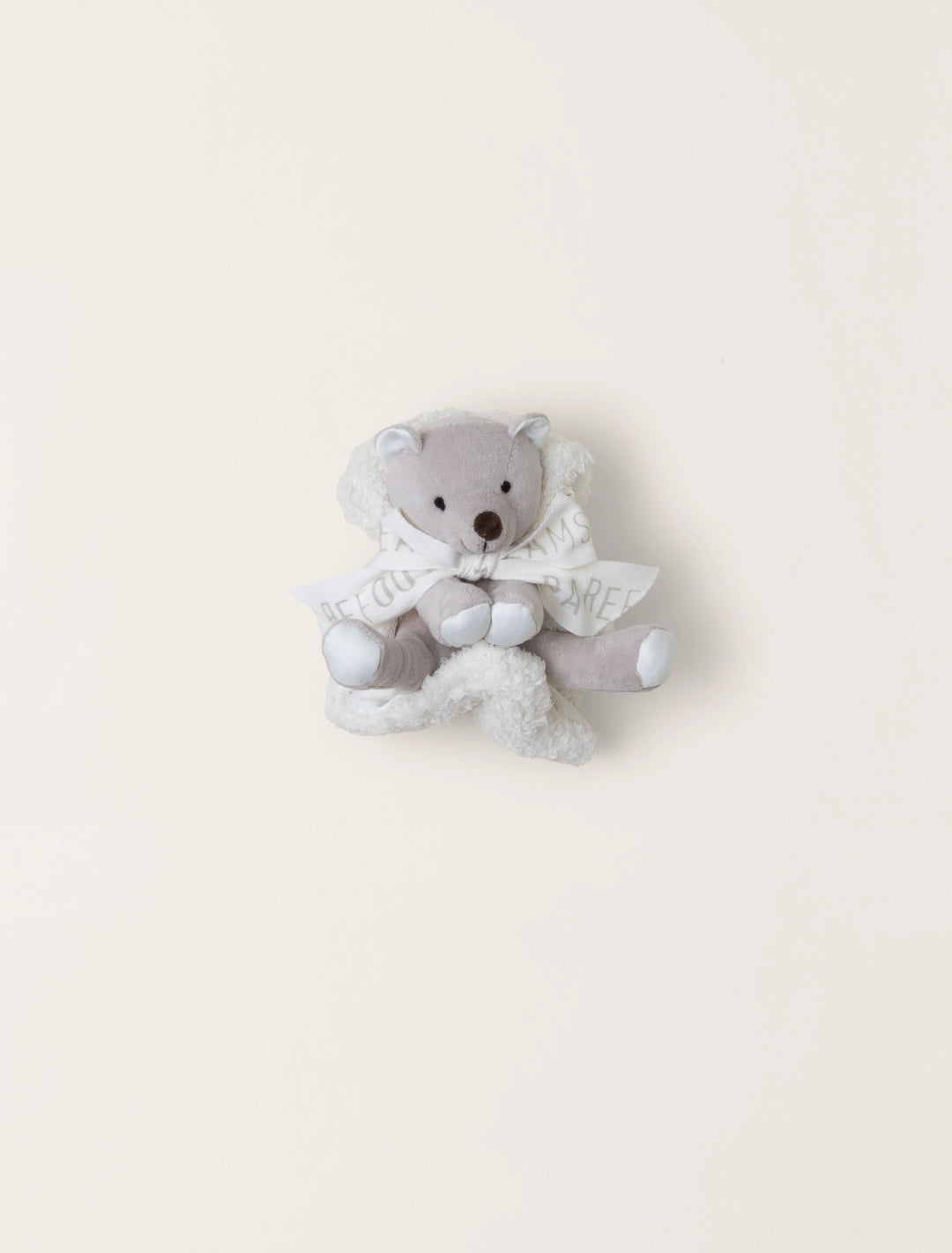 Barefoot Buddie baby sock slippers from Barefoot Dreams, soft fabric with a cozy design for little feet.