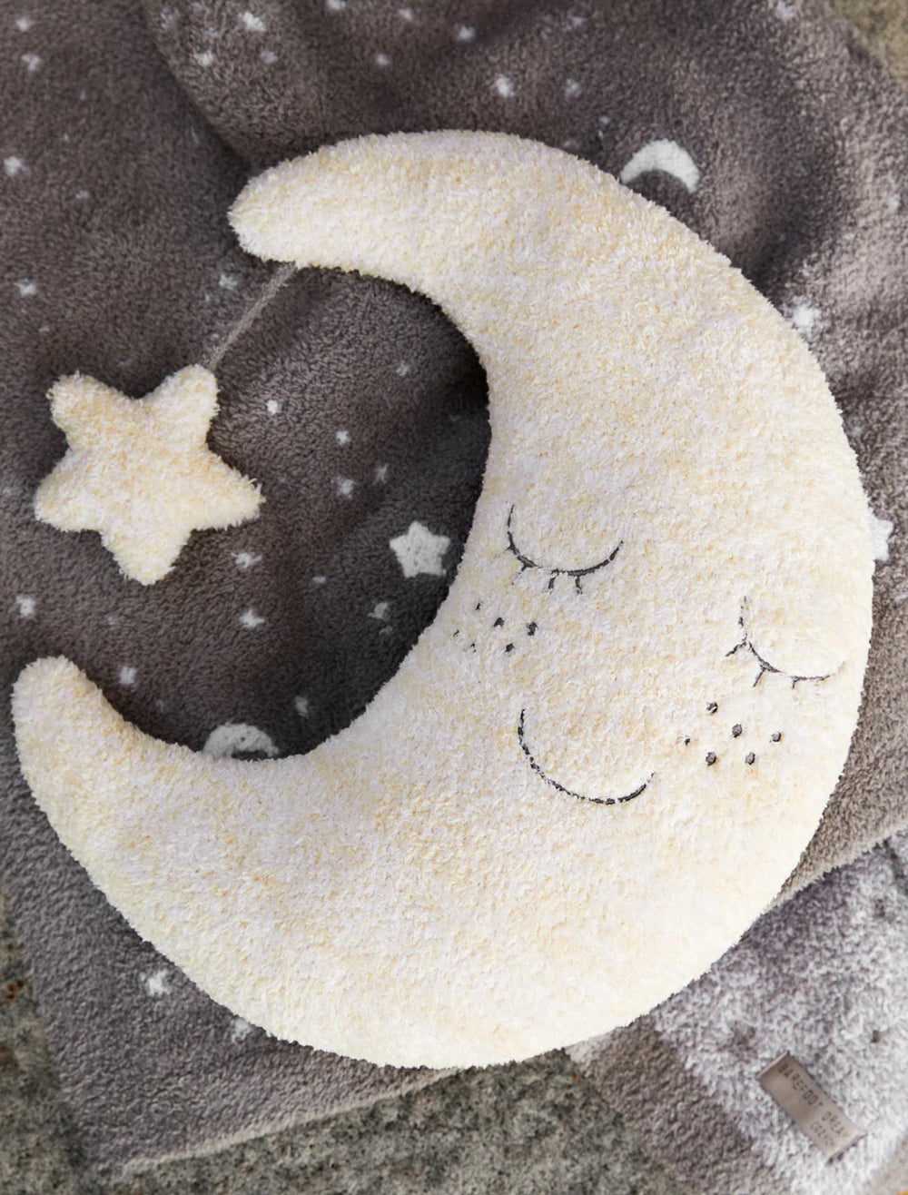 Soft baby Moon Buddie plush toy by Barefoot Dreams, with a gentle moon design and cozy, plush fabric for infants.