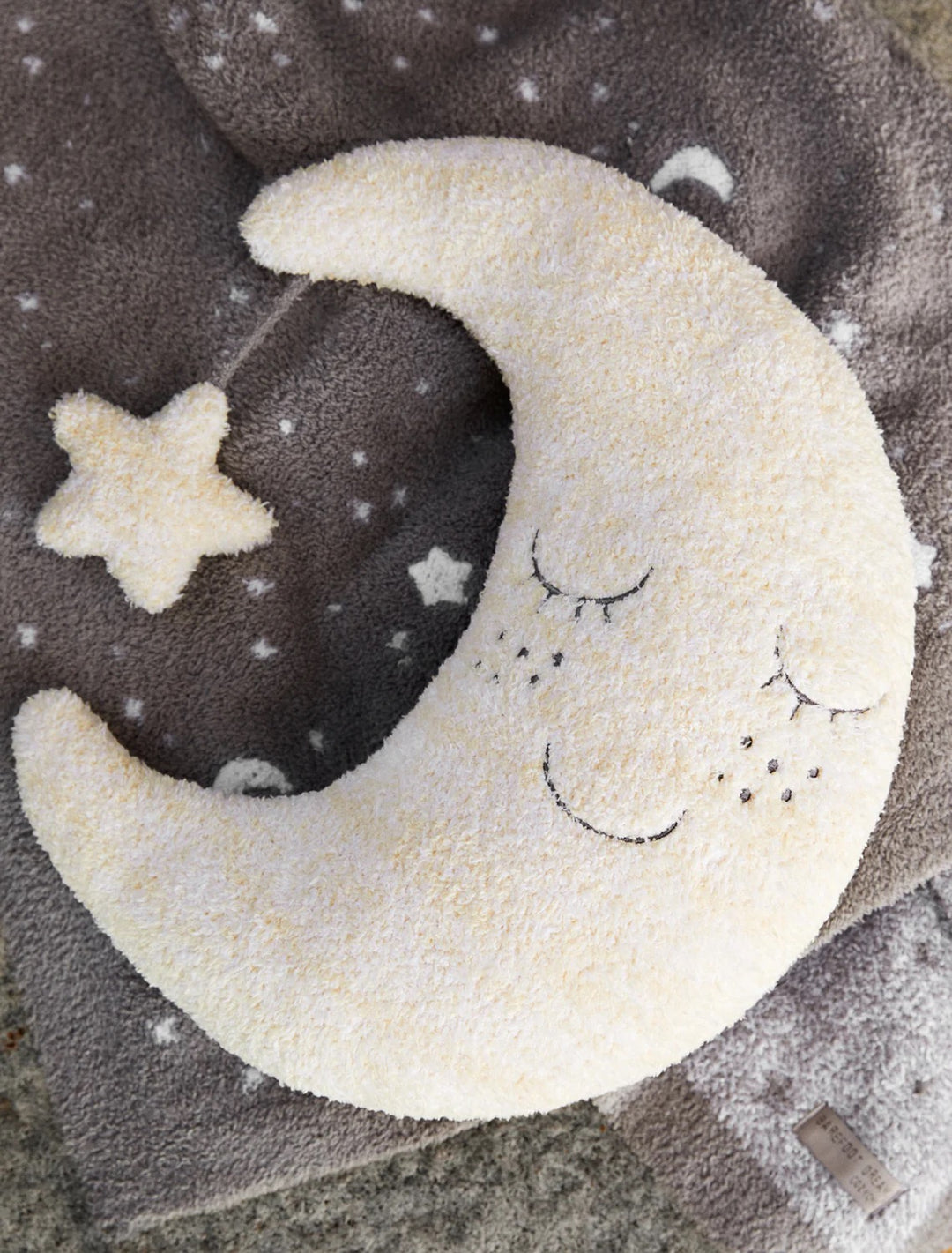 Soft baby Moon Buddie plush toy by Barefoot Dreams, with a gentle moon design and cozy, plush fabric for infants.