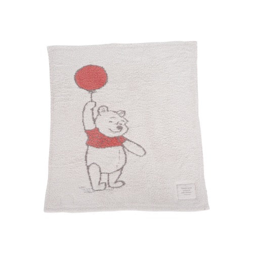 Soft Winnie the Pooh baby blanket by Barefoot Dreams, featuring plush fabric and classic character design perfect for infants.