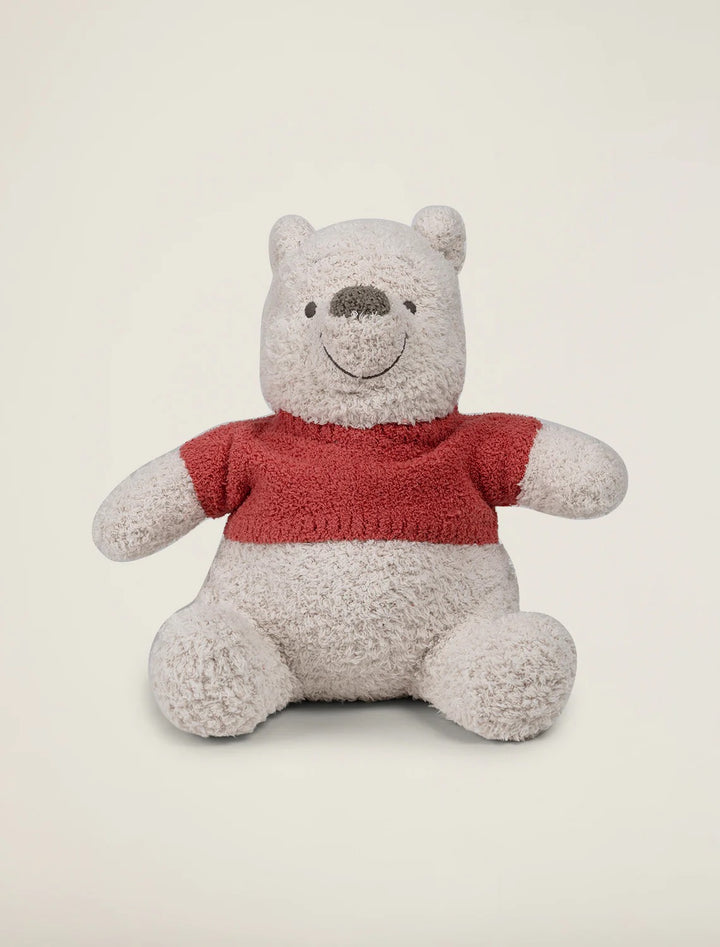 Soft Winnie the Pooh baby stuffed animal by Barefoot Dreams, plush and cuddly, perfect for comforting infants and young children.