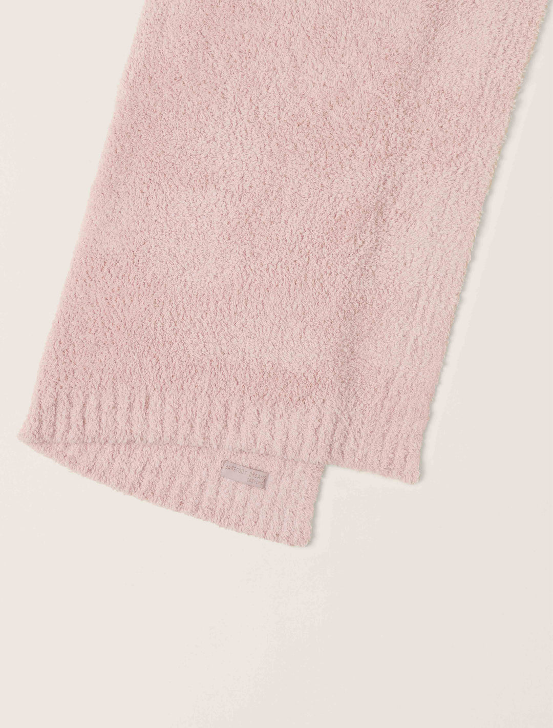 Barefoot Dreams CozyChic baby stroller blanket in soft, plush fabric, perfect for keeping a baby warm during outings.