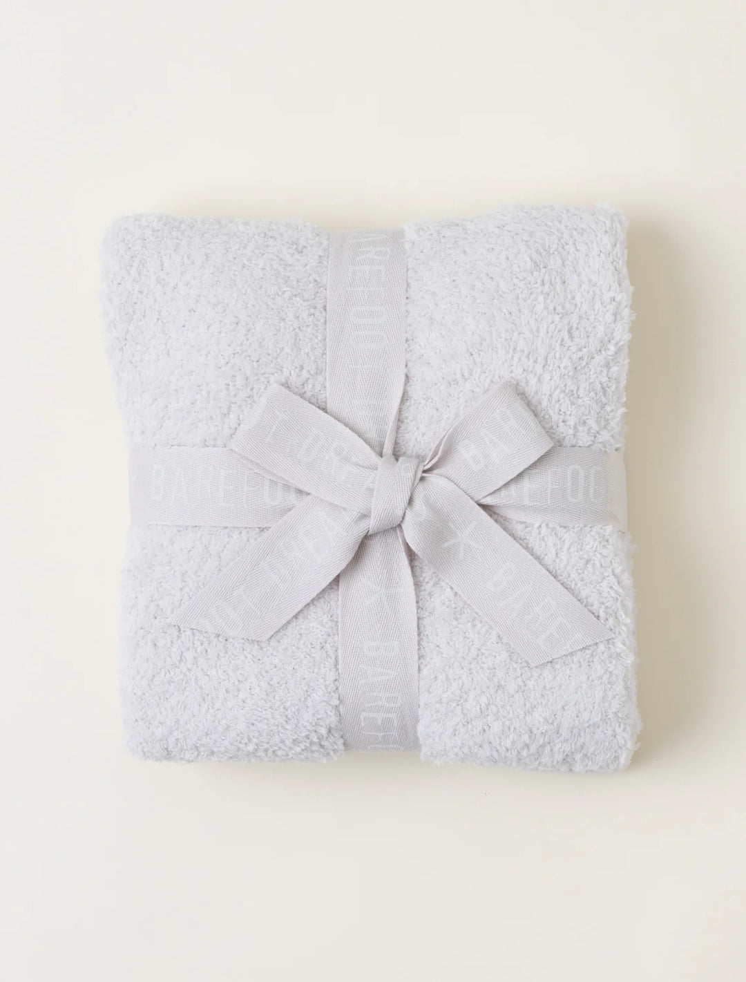Barefoot Dreams CozyChic baby stroller blanket in soft, cozy knit fabric, perfect for keeping your little one warm.
