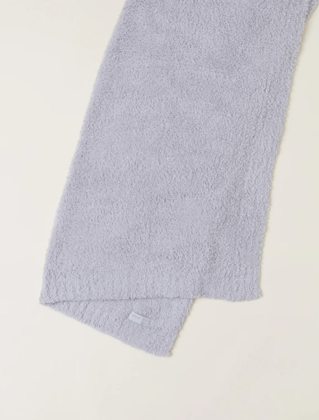 Barefoot Dreams CozyChic baby stroller blanket in soft, plush fabric with a neutral color, perfect for keeping infants warm and comfortable.
