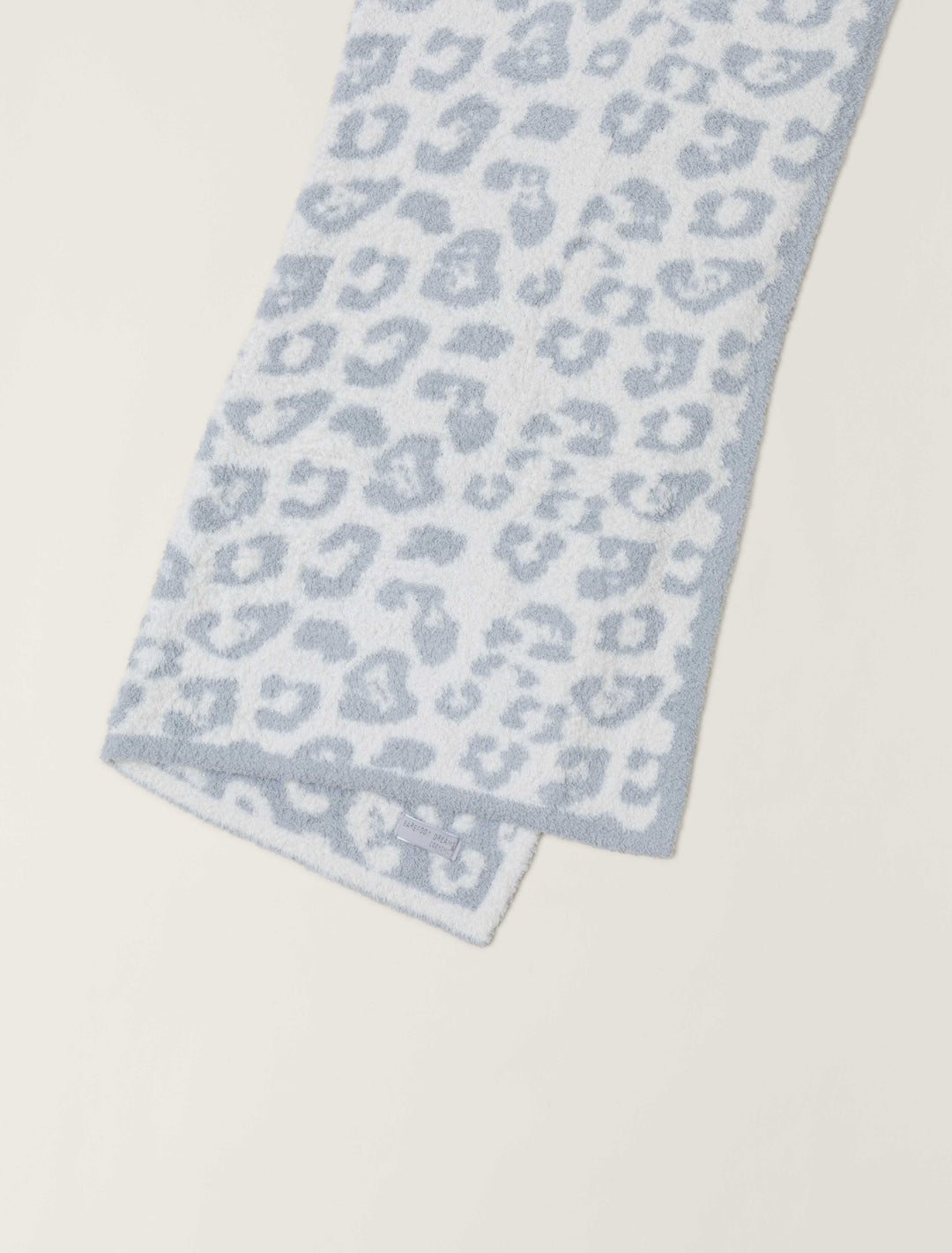 Barefoot Dreams In The Wild baby blanket gift, soft and cozy with a nature-inspired pattern, perfect for wrapping new arrivals.