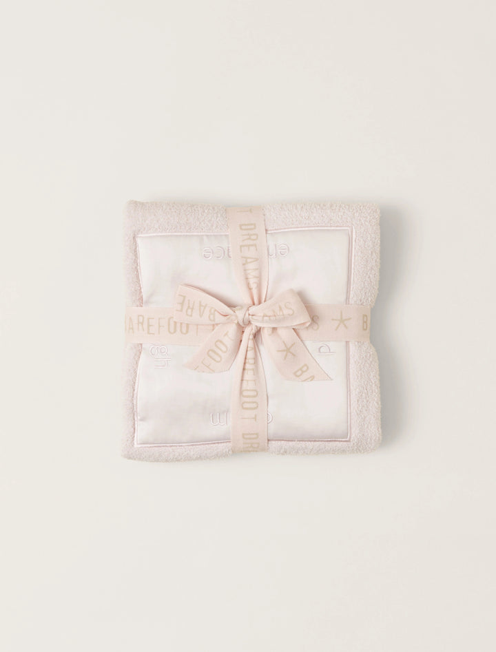 Barefoot Dreams satin trim receiving blanket with soft, luxurious fabric and delicate satin edging for optimal comfort.