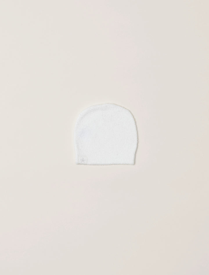 Soft beige barefoot dreams cozy infant beanie with ribbed knit texture, perfect for keeping babies warm and stylish.