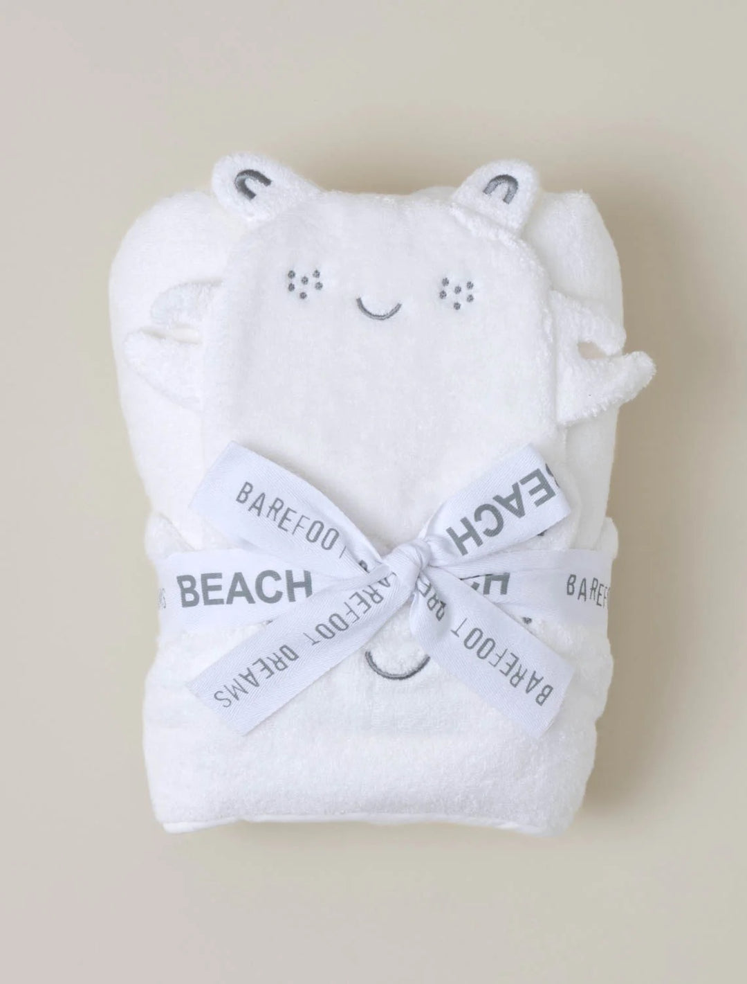 Barefoot Dreams hooded towel and washcloth set for babies, soft plush fabric with hooded towel featuring a cute design and matching washcloths.