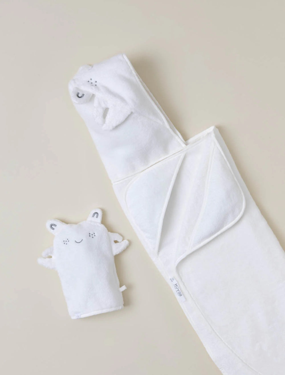 Barefoot Dreams hooded towel and washcloth gift set featuring soft, plush fabric with hooded towel and matching washcloths for children.
