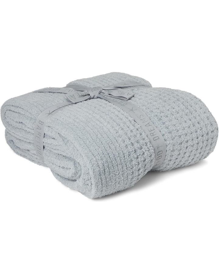 Soft cozy waffle throw blanket by Barefoot Dreams, featuring textured waffle knit in neutral tones for home comfort.