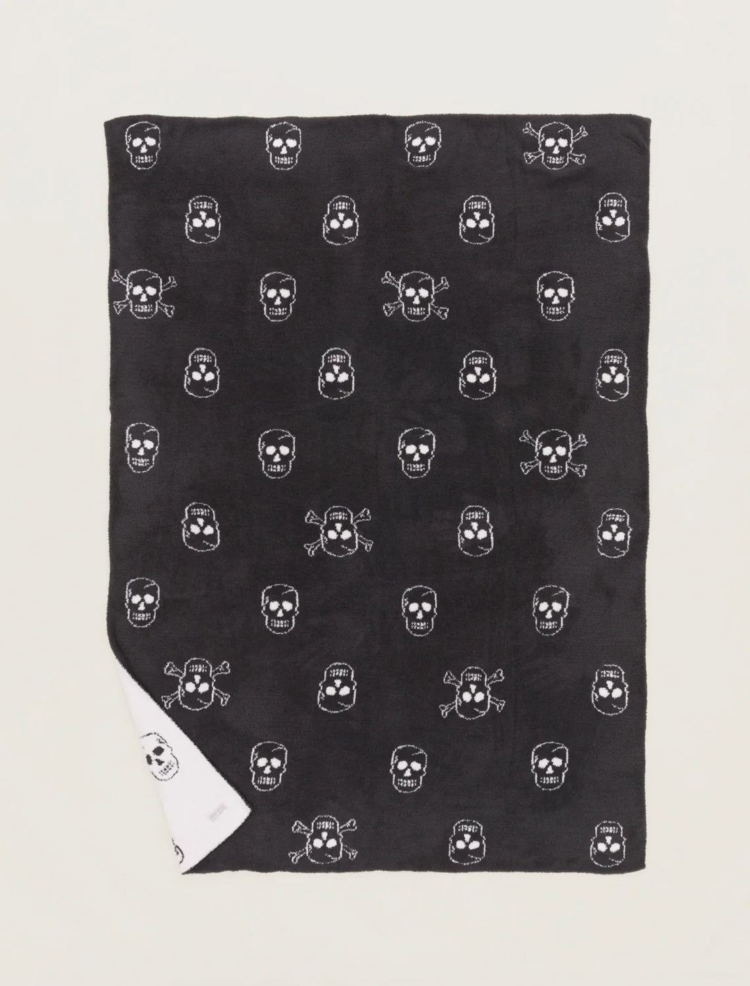 Barefoot Dreams Cozy Chic Skull throw blanket with a soft, plush texture and a stylish skull design for home decor.