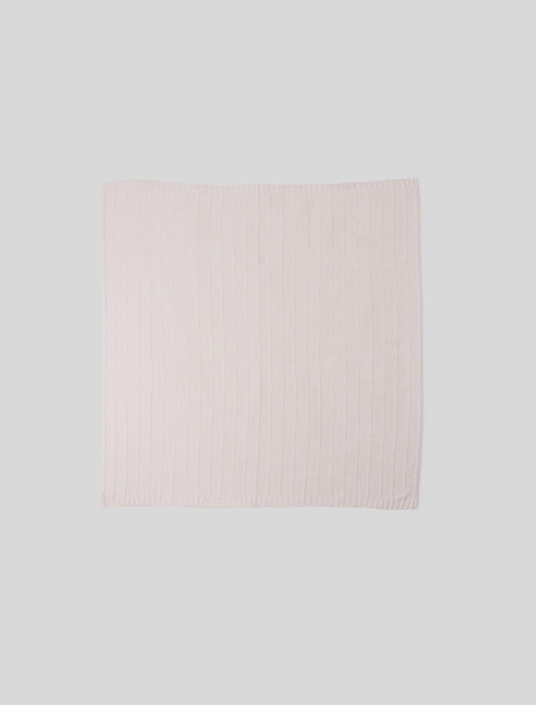 Barefoot Dreams cozy herringbone bed blanket in soft, neutral tones, folded neatly on a bed for a stylish home decor look
