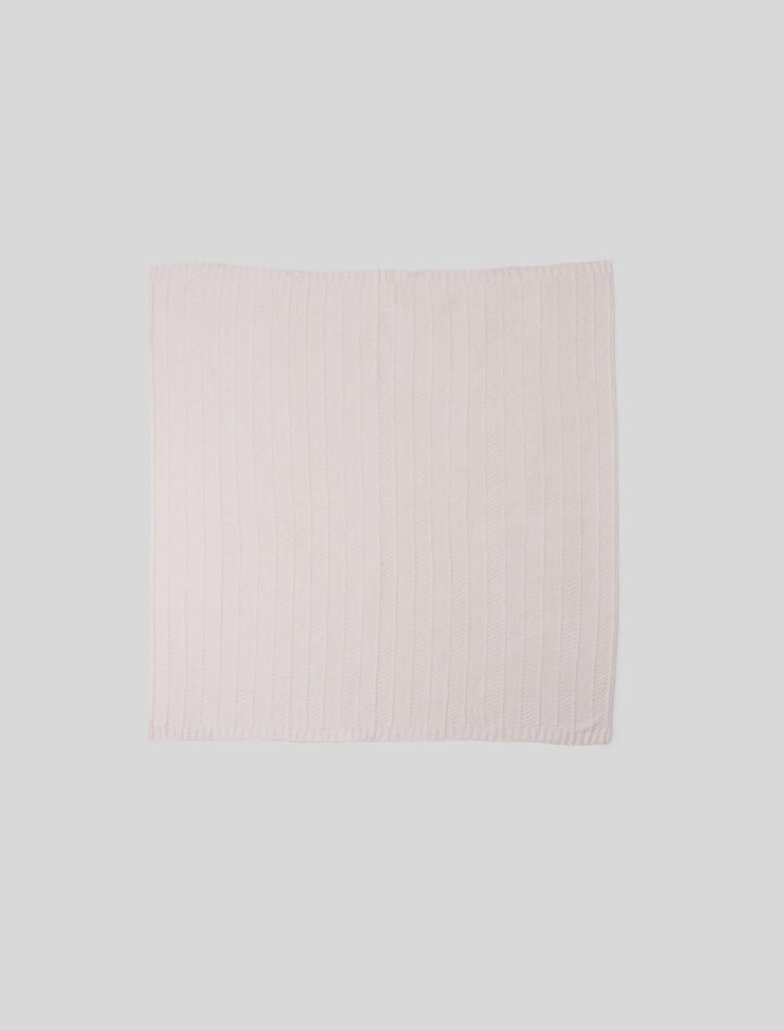 Barefoot Dreams cozy herringbone bed blanket in soft, neutral tones, folded neatly on a bed for a stylish home decor look