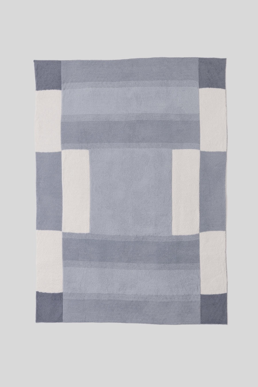 Barefoot Dreams Cozy Costa Block throw blanket with soft, plush fabric and geometric pattern for cozy home decor.