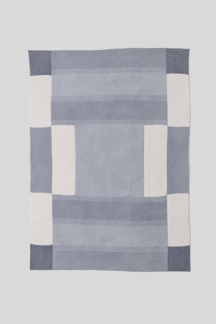 Barefoot Dreams Cozy Costa Block throw blanket with soft, plush fabric and geometric pattern for cozy home decor.
