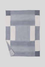 Barefoot Dreams Cozy Costa Block throw blanket with soft, textured fabric for comfortable home decor.