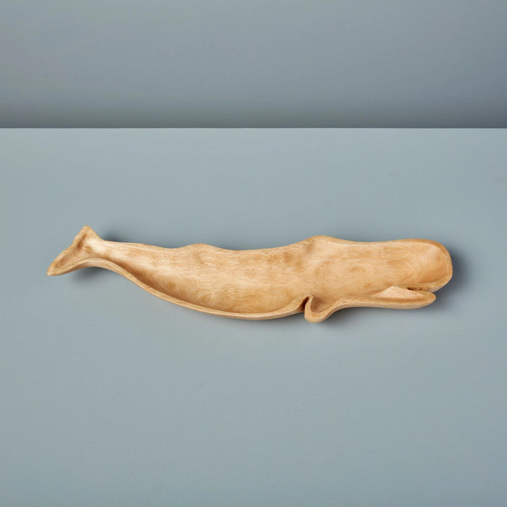 Whale-shaped dish made of mango wood from Be Home, suitable for home decor or serving small items.