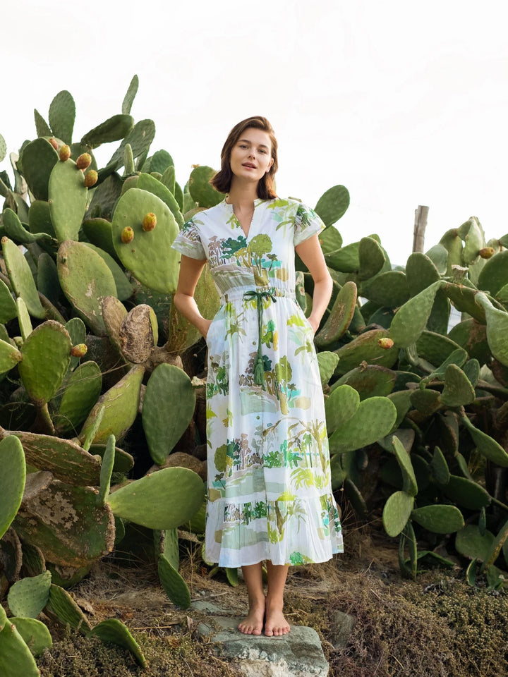 Beau & Ro palm flutter midi dress, lightweight fabric with tropical print, flowing silhouette, and short flutter sleeves.