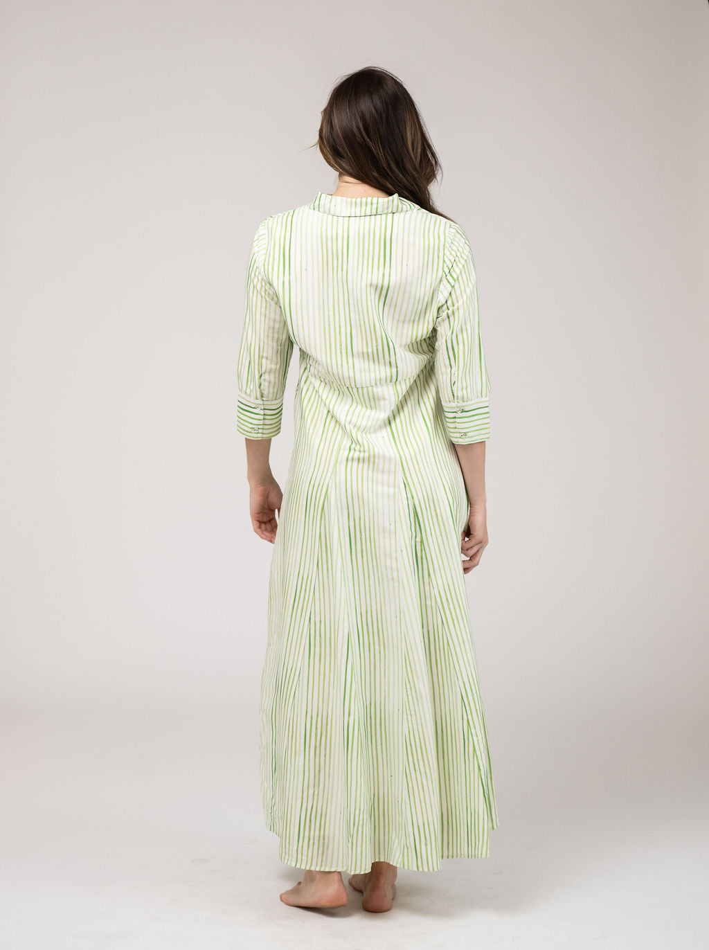 Beau & Ro Alexa English Stripe Dress displayed on a hanger, featuring classic blue and white stripes and a fitted silhouette.