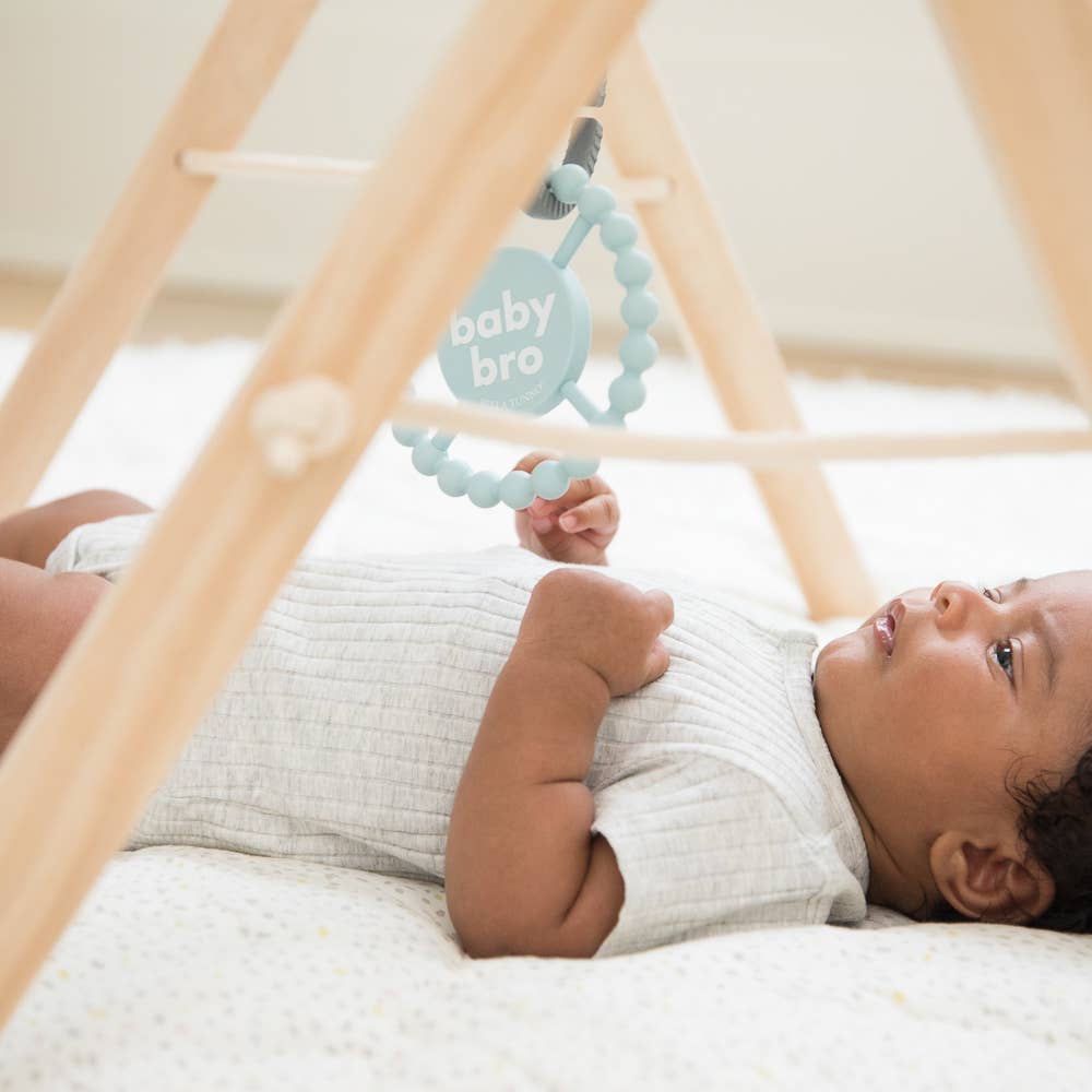 Baby Bella Tunno Happy Teether in bright colors, designed for soothing and teething relief for infants.