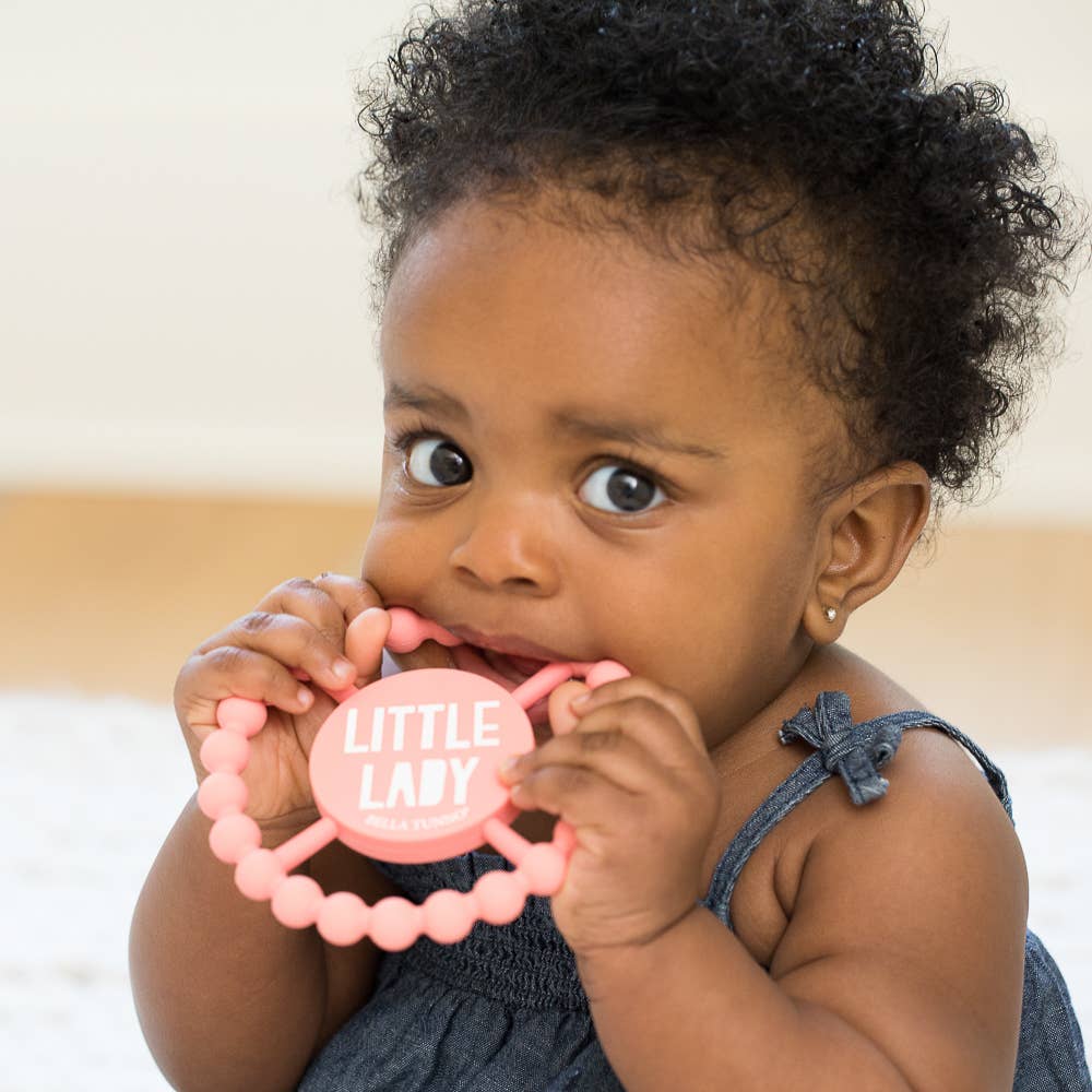 Bella Tunno Little Lady Happy Teether for babies, soft silicone teether with colorful ladybug design, easy for little hands to hold.