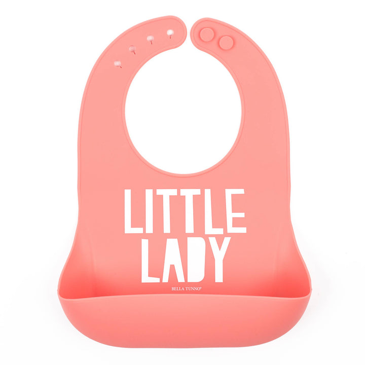 Pink baby bib from Bella Tunno Little Lady Wonder Bib with cute ladybug design, soft fabric, and adjustable neck strap.