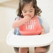 Baby wearing Little Lady Wonder Bib by Bella Tunno, soft pink and white bib with cute design for everyday use.
