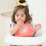 Baby wearing the pink Little Lady Wonder Bib by Bella Tunno, soft and absorbent bib with cute ladybug design.