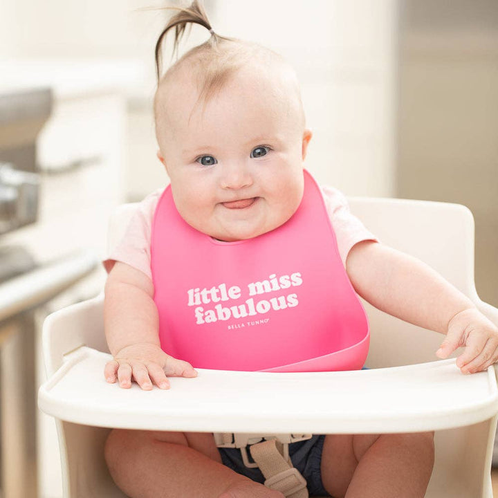 Baby wearing the Bella Tunno Little Miss Fabulous Wonder Bib, colorful and soft baby bib with fun design for feeding time.
