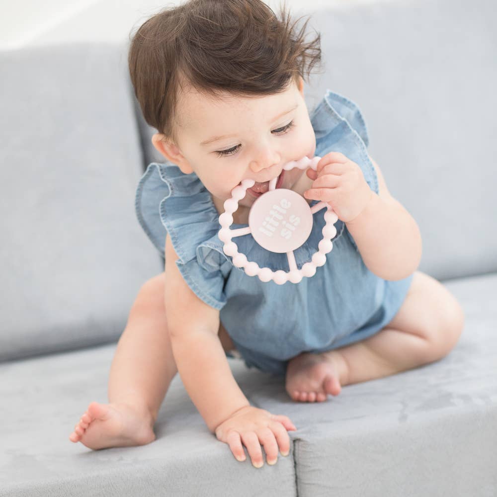 Baby Bella Tunno Little Sis Happy Teether in soft pastel colors with textured surface for soothing gums.