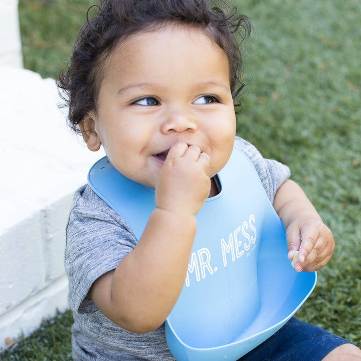 Bella Tunno Mr Mess Wonder Bib for babies, soft and adjustable with colorful patterns, designed to keep clothes clean during feeding.