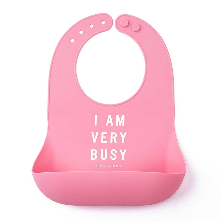 Baby wearing Bella Tunno Very Busy Wonder Bib, soft and colorful baby bib with fun print for mealtime.