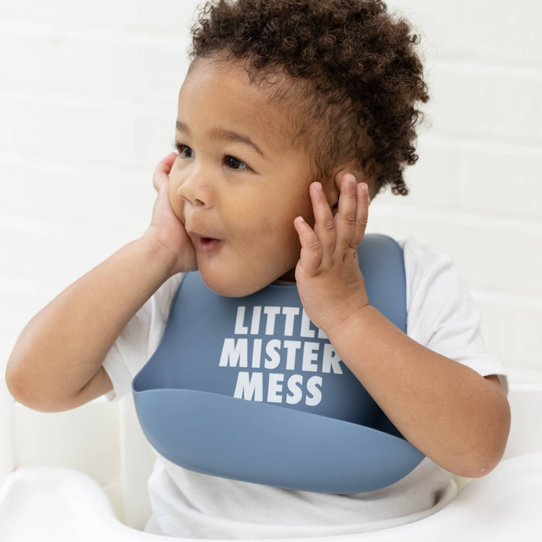 Bella Tunno Little Mister Mess Wonder Bib with colorful, adjustable fabric design for easy cleaning and mess protection.