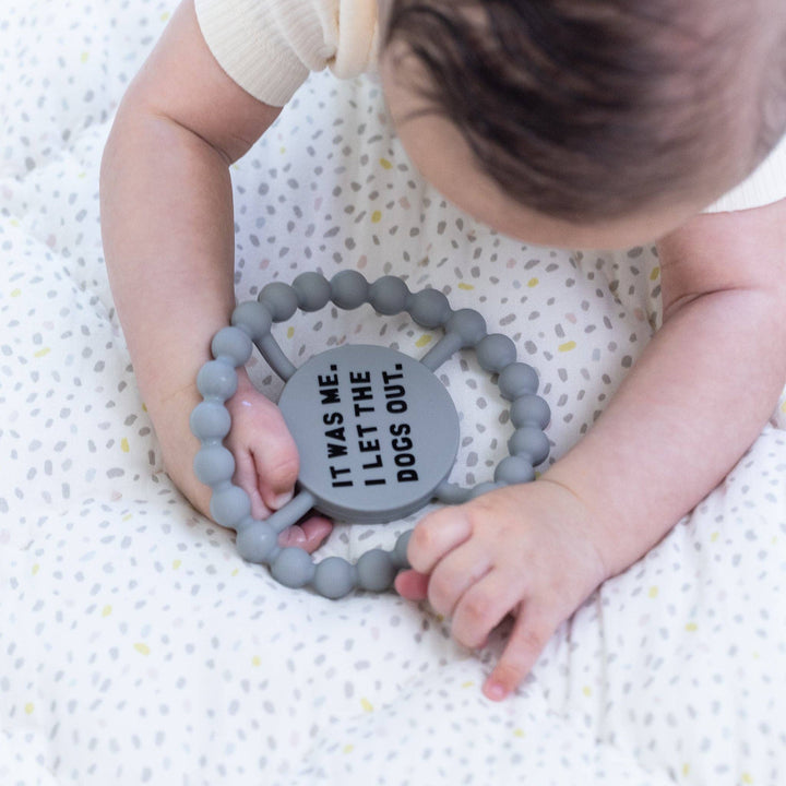 Bella Tunno Dogs Out Happy Teether gift for babies, featuring colorful dog designs and soft, chew-friendly material.