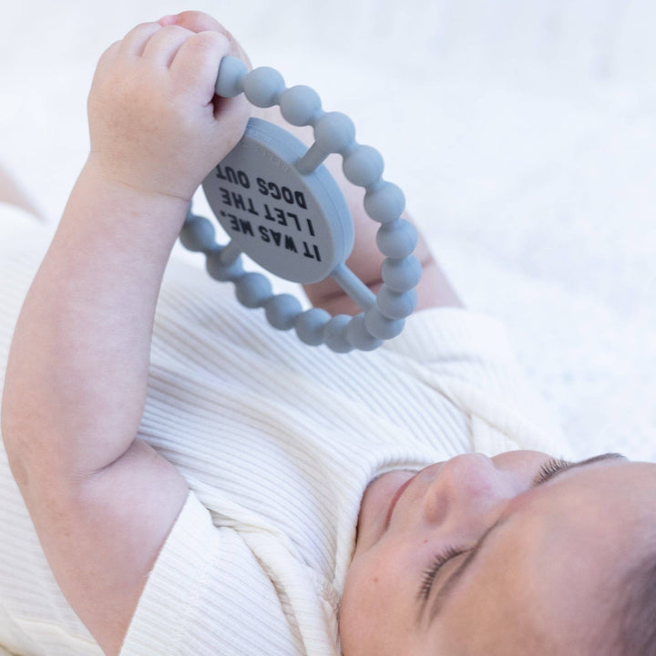 Dogs Out Happy Teether gift by Bella Tunno, soft silicone teether with colorful dog design for soothing teething relief.