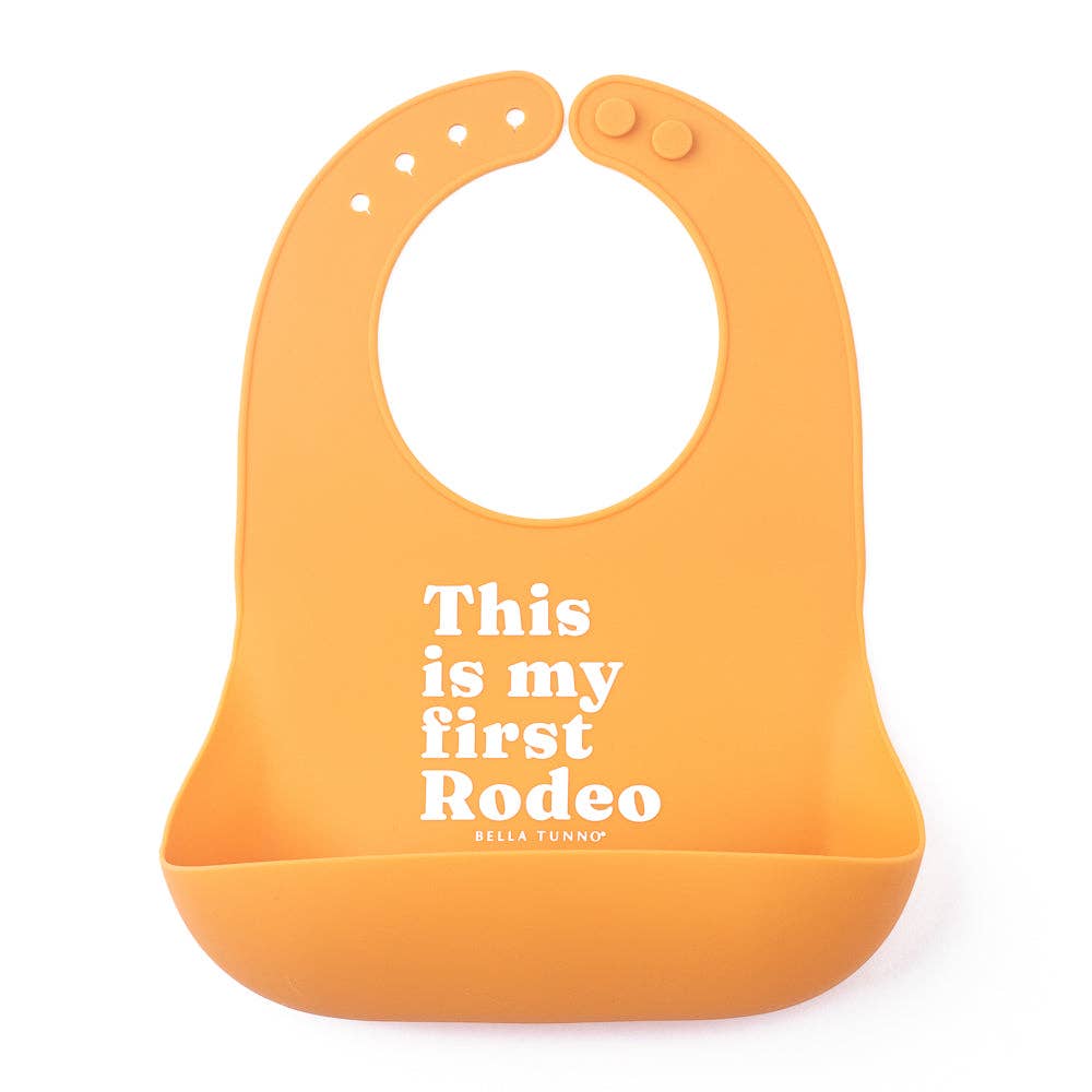 Bella Tunno First Rodeo Wonder Bib, soft and colorful baby bib with playful design for gift-giving and everyday use.