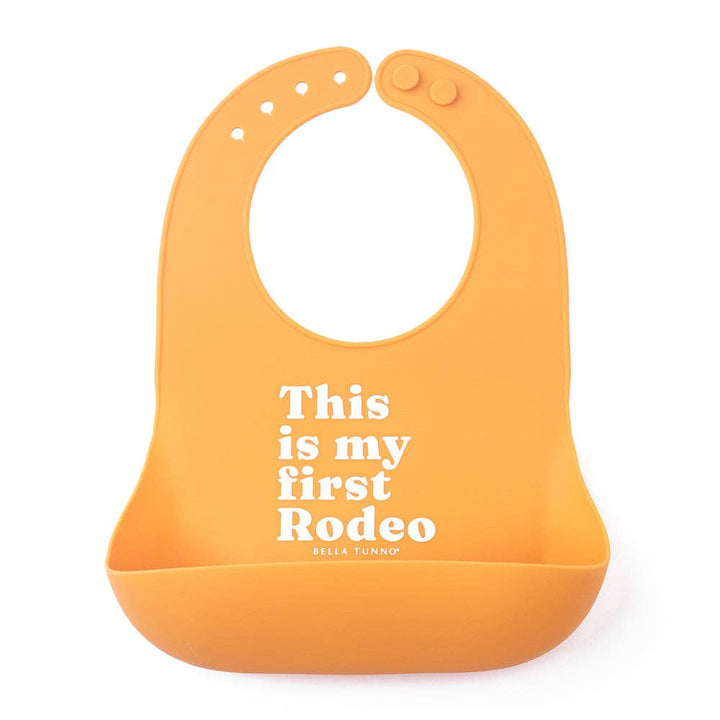 Bella Tunno First Rodeo Wonder Bib, soft and colorful baby bib with playful design for gift-giving and everyday use.